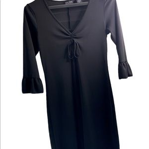 New York & Company’s perfect little black dress! Small bell sleeves & side slits